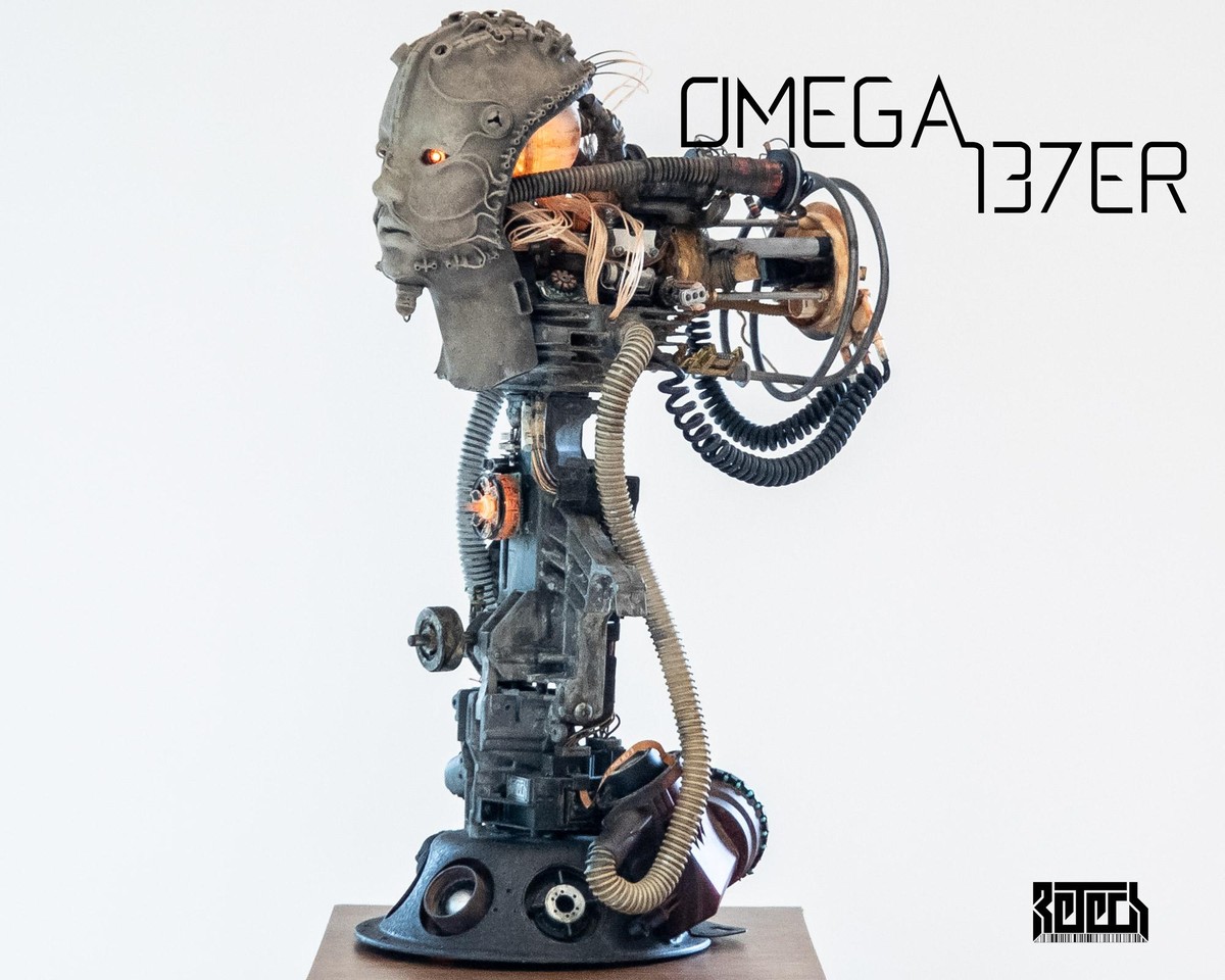 A biomechanical/human bust sculpture.