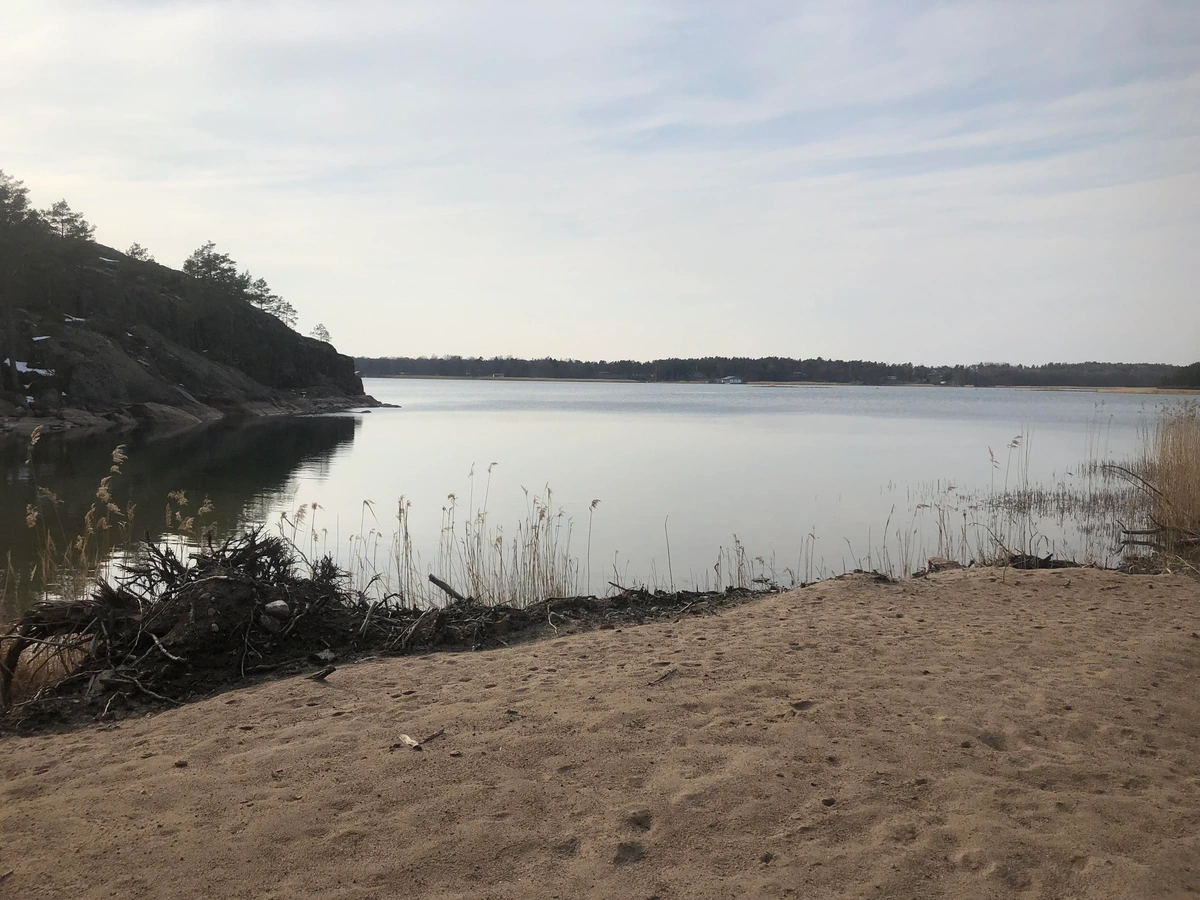 Photo of a calm bay from a natural beach.
